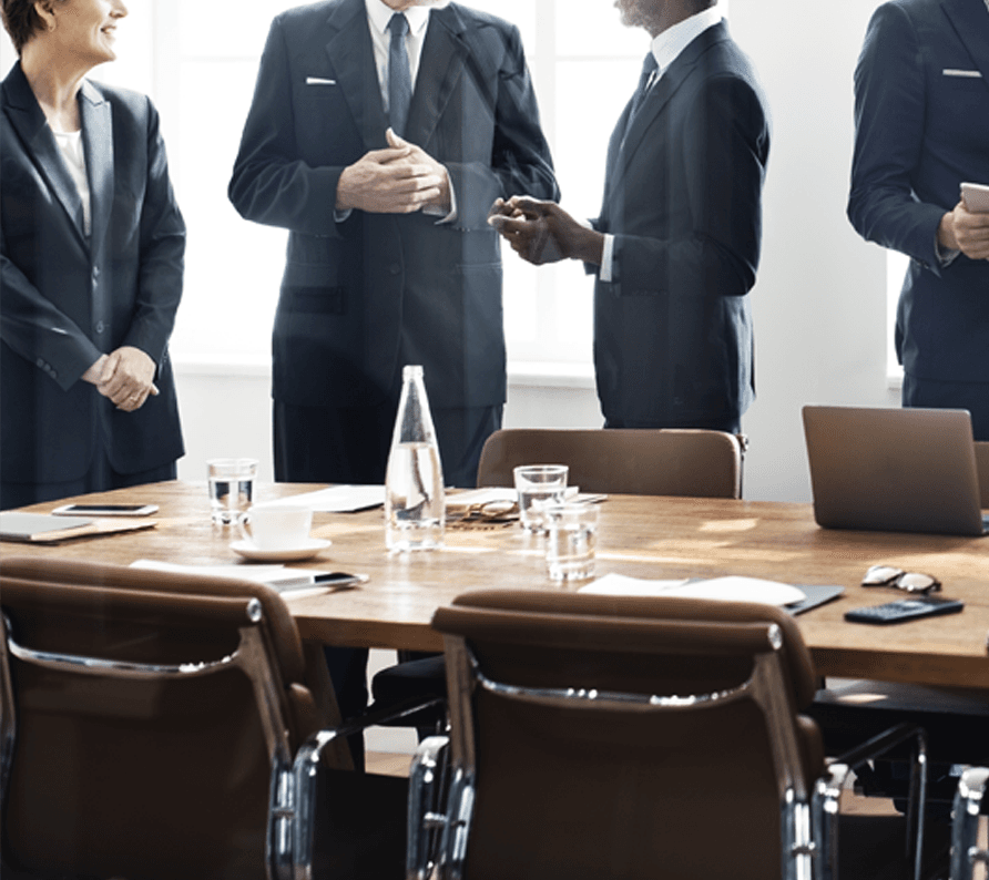 Business partners in suits gathered in meeting room