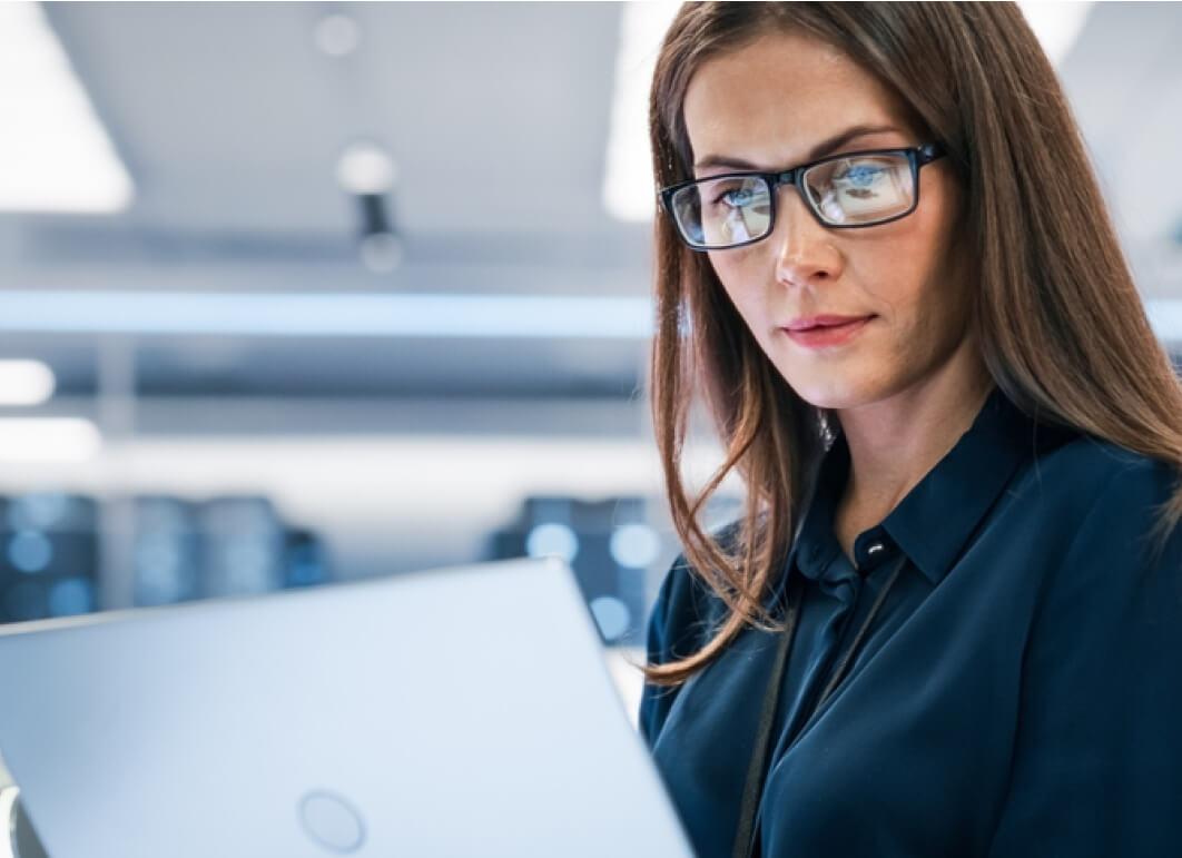 Woman attentively looking at her computer